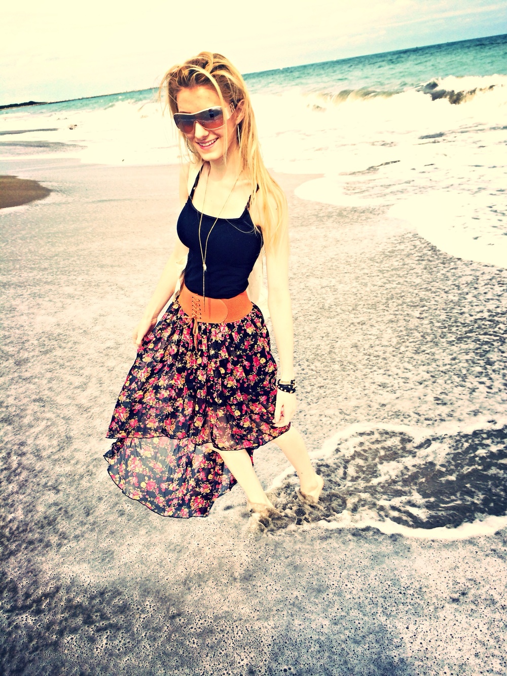 Fashion and lifestyle blogger Jessica Linn wearing a high-low skirt from Ross, peep toe heel boots by Guess, and staying at beaches in Florida.