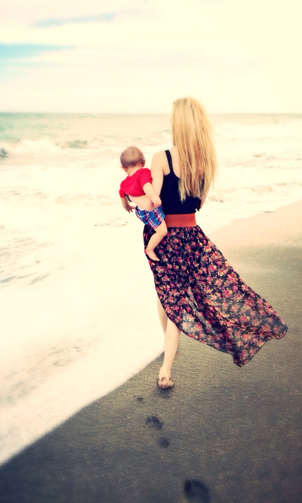 Fashion and lifestyle blogger Jessica Linn wearing a high-low skirt from Ross, peep toe heel boots by Guess, and staying at beaches in Florida.