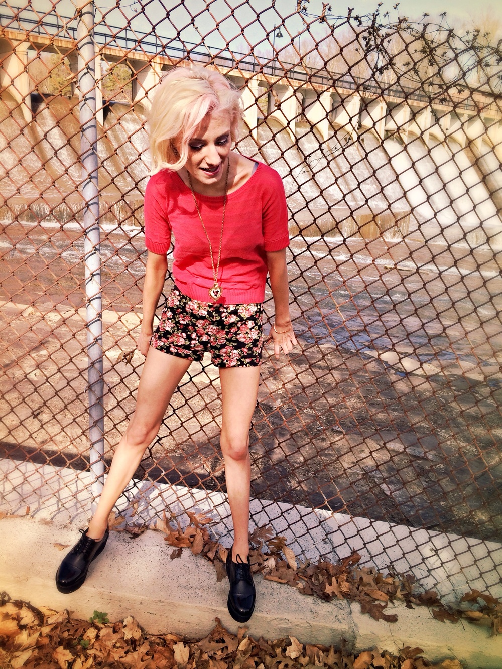 North Carolina fashion and lifestyle blogger Jessica Linn wearing a green cardigan from Target, a pink sweater and floral high-waisted shorts from Forever21, and Steve Madden platform shoes.