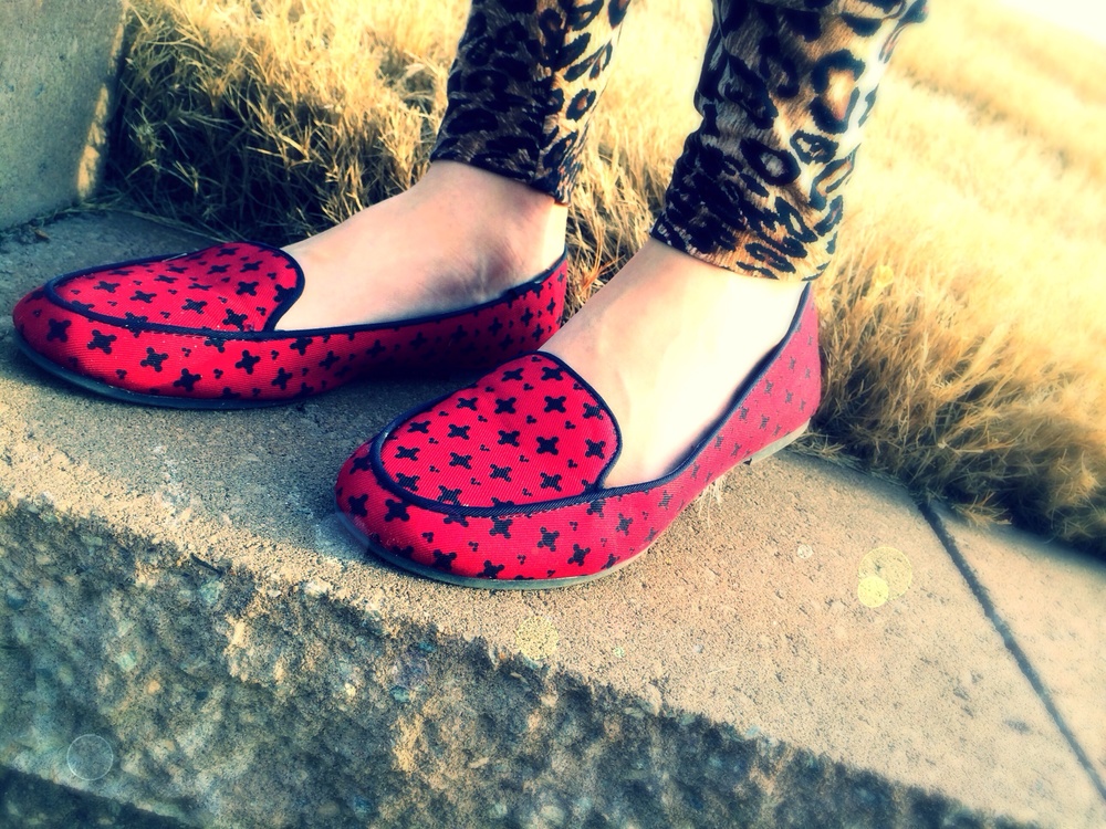 North Carolina fashion and lifestyle blogger Jessica Linn wearing leopard print harem pants, and a black tank top from Forever21, and red flats from GAP.