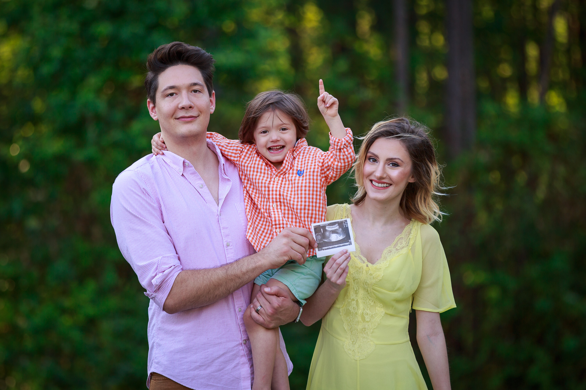 Fashion blogger, Jessica Linn of Linn Style, family photo pregnancy announcement with son and husband Joel Pagan , Jessica Linn is wearing a popular spring trend of pastel yellow and lace dress from ASOS.