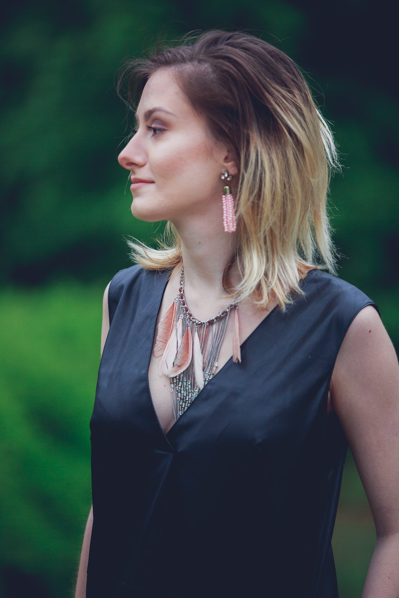 Lifestyle and Fashion Blogger, Jessica Linn, wearing a faux leather Forever21 dress, ASOS heels, a statement necklace from Target, earrings from the Baublebar, and carrying a Matt and Nat purse.