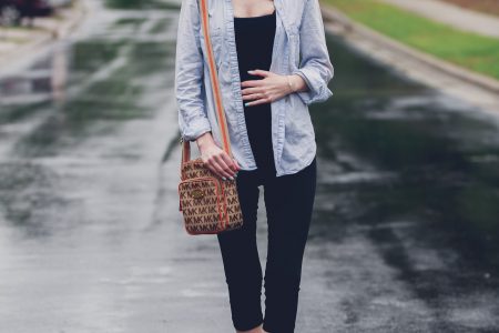 Fashion and lifestyle blogger Jessica Linn from Linn Style wearing a casual outfit: Target maternity leggings, an aeropostale tank top, and chambray button up, Target tennis shoes, Charming Charlie's earrings, and a Michael Kors purse in Cary North Carolina