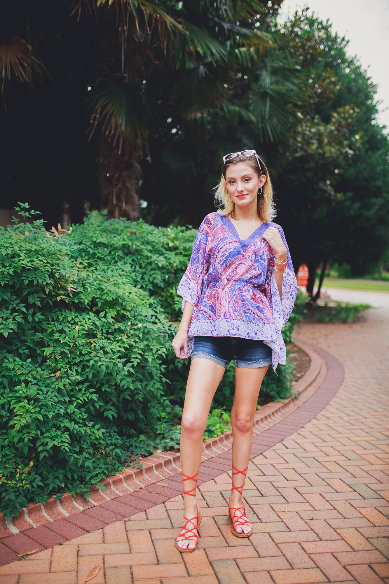 Lifestyle, fashion, and beauty blogger and vlogger, Jessica Linn, from Linn Style wearing a Paisley shear top with maternity shorts and Forever21 sandals and Charming Charlie's accessories.