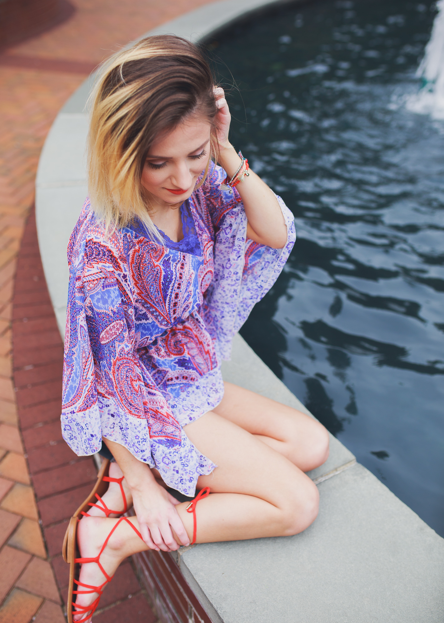 Lifestyle, fashion, and beauty blogger and vlogger, Jessica Linn, from Linn Style wearing a Paisley shear top with maternity shorts and Forever21 sandals and Charming Charlie's accessories.