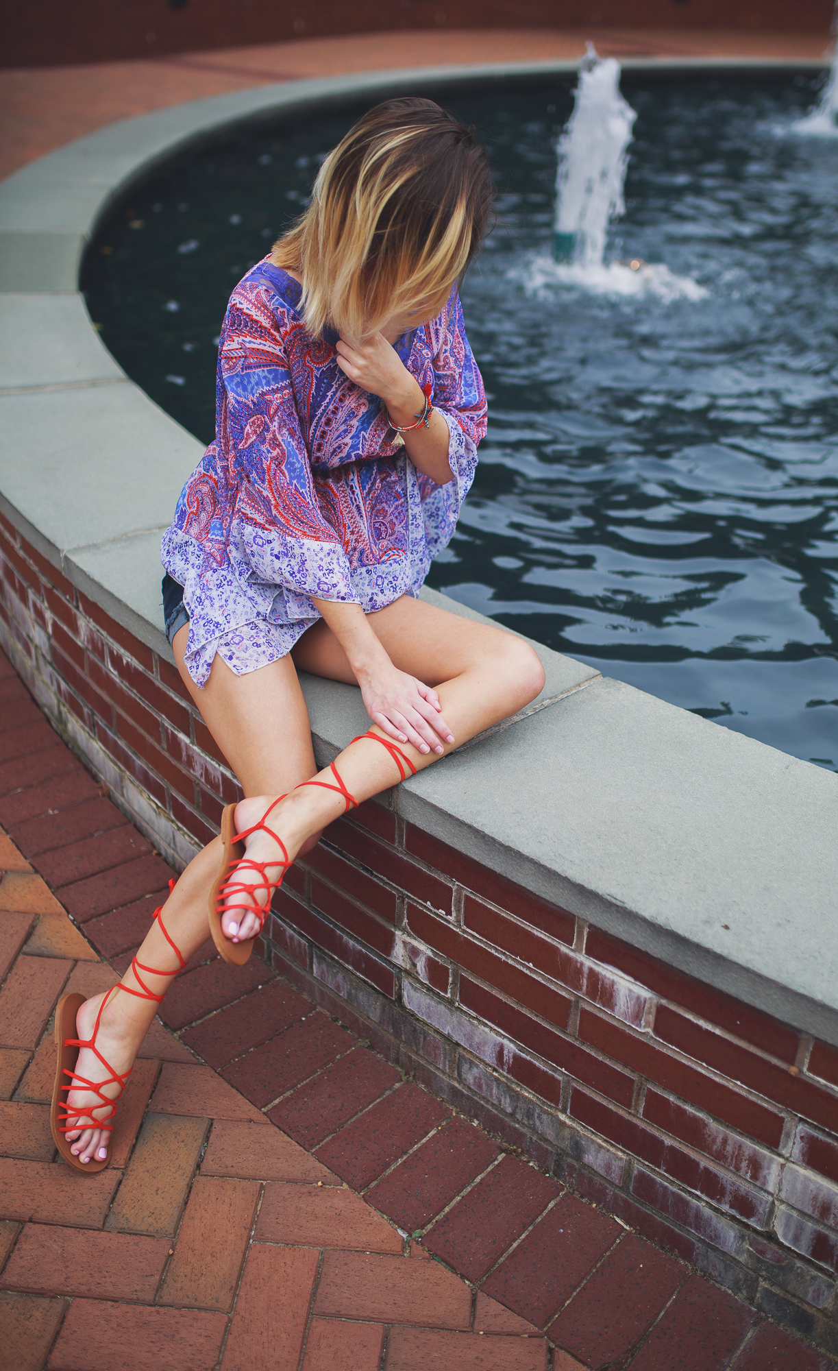 Lifestyle, fashion, and beauty blogger and vlogger, Jessica Linn, from Linn Style wearing a Paisley shear top with maternity shorts and Forever21 sandals and Charming Charlie's accessories.