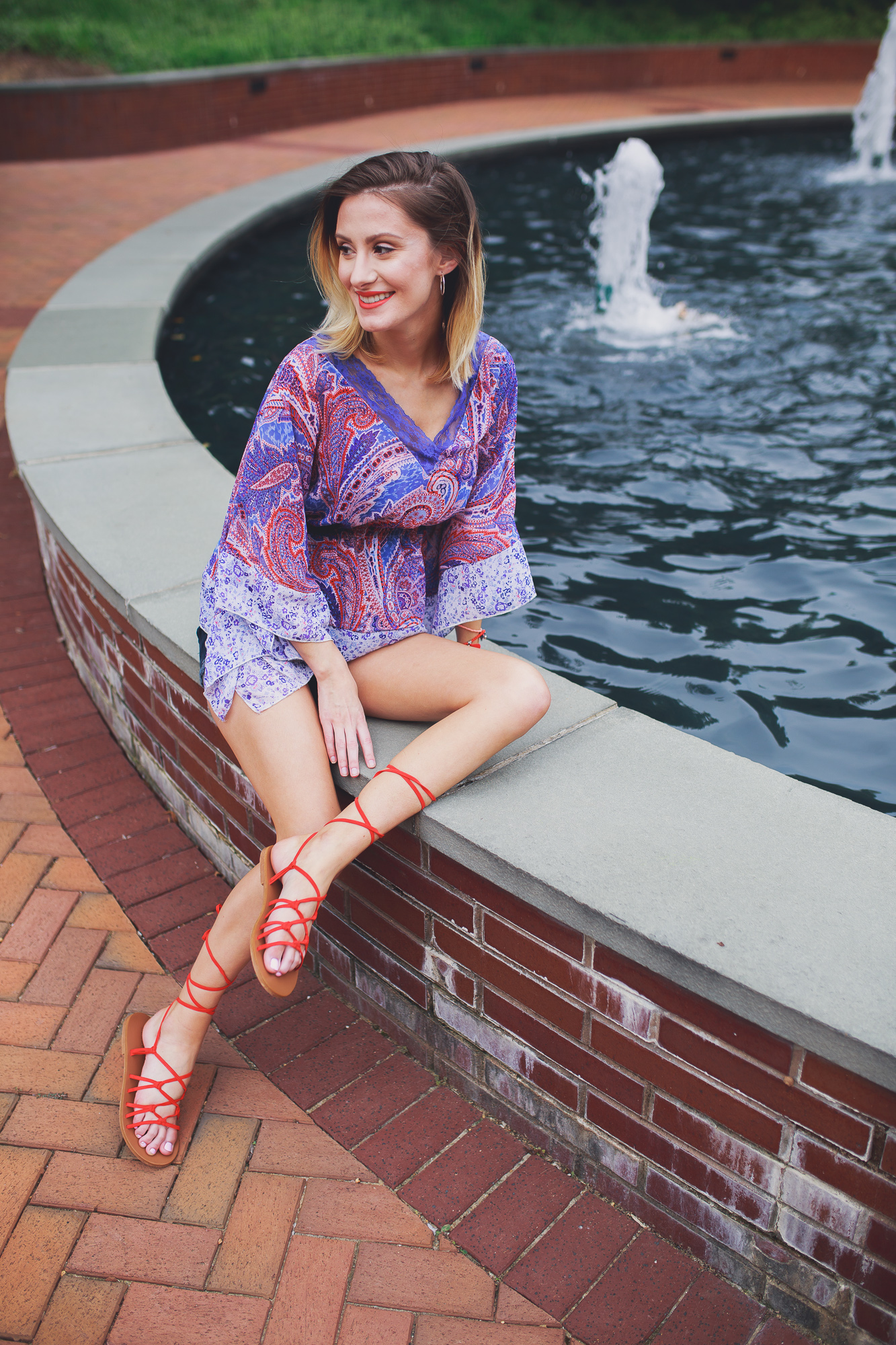 Lifestyle, fashion, and beauty blogger and vlogger, Jessica Linn, from Linn Style wearing a Paisley shear top with maternity shorts and Forever21 sandals and Charming Charlie's accessories.