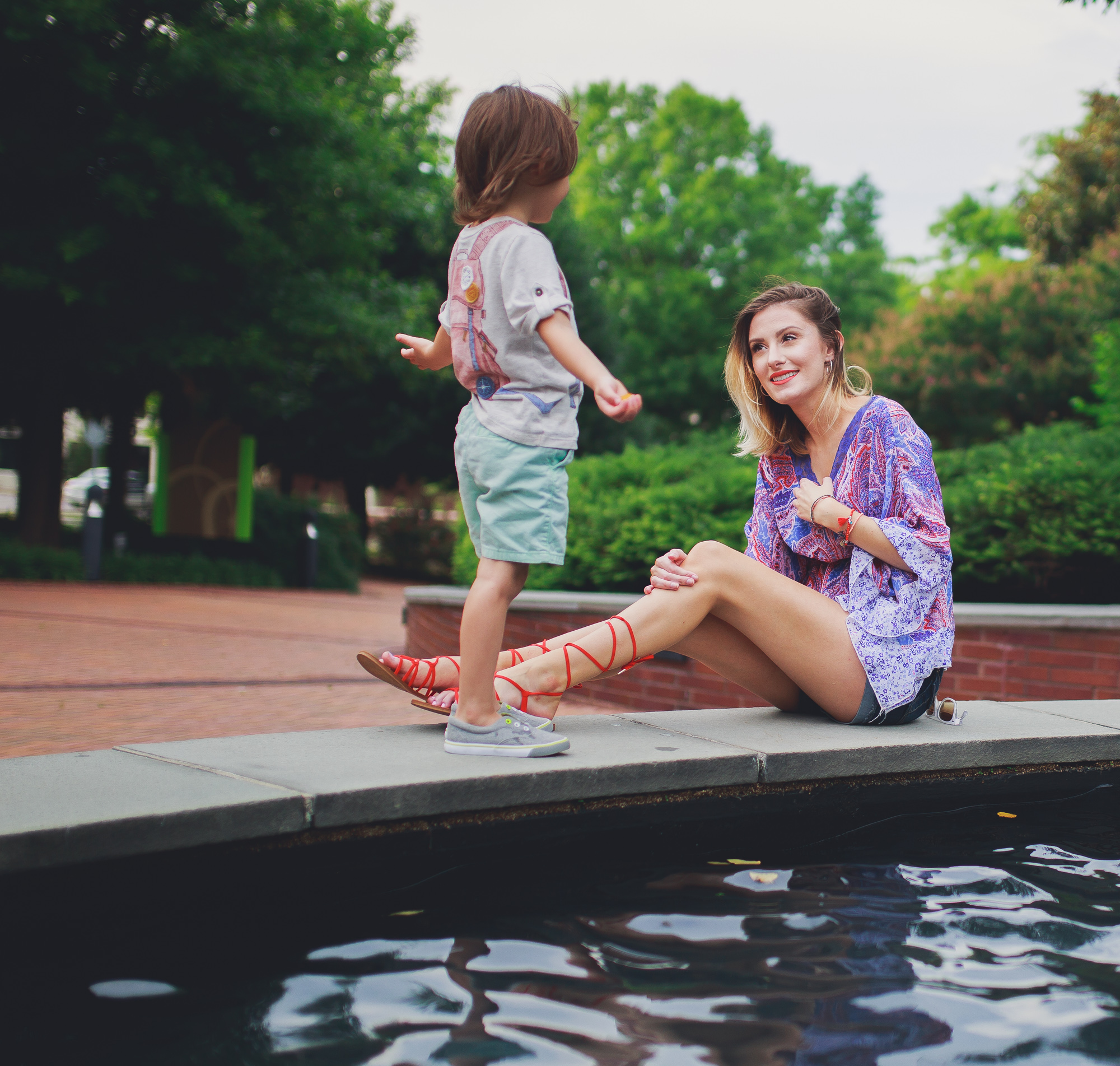 Lifestyle, fashion, and beauty blogger and vlogger, Jessica Linn, from Linn Style wearing a Paisley shear top with maternity shorts and Forever21 sandals and Charming Charlie's accessories.