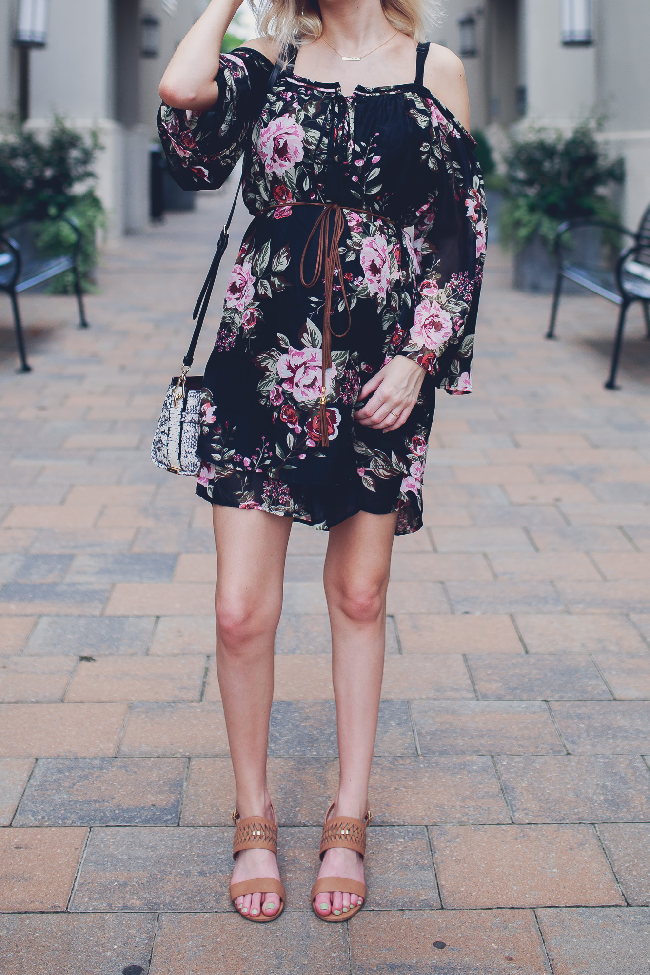 Fashion, lifestyle, and beauty blogger / vlogger Jessica Linn from Linn Style wearing an off the shoulder black floral mid thigh dress with Matisse footwear heels, a coach purse, and a Mamma Bear necklace from CY Design Studio in North Hills Raleigh North Carolina