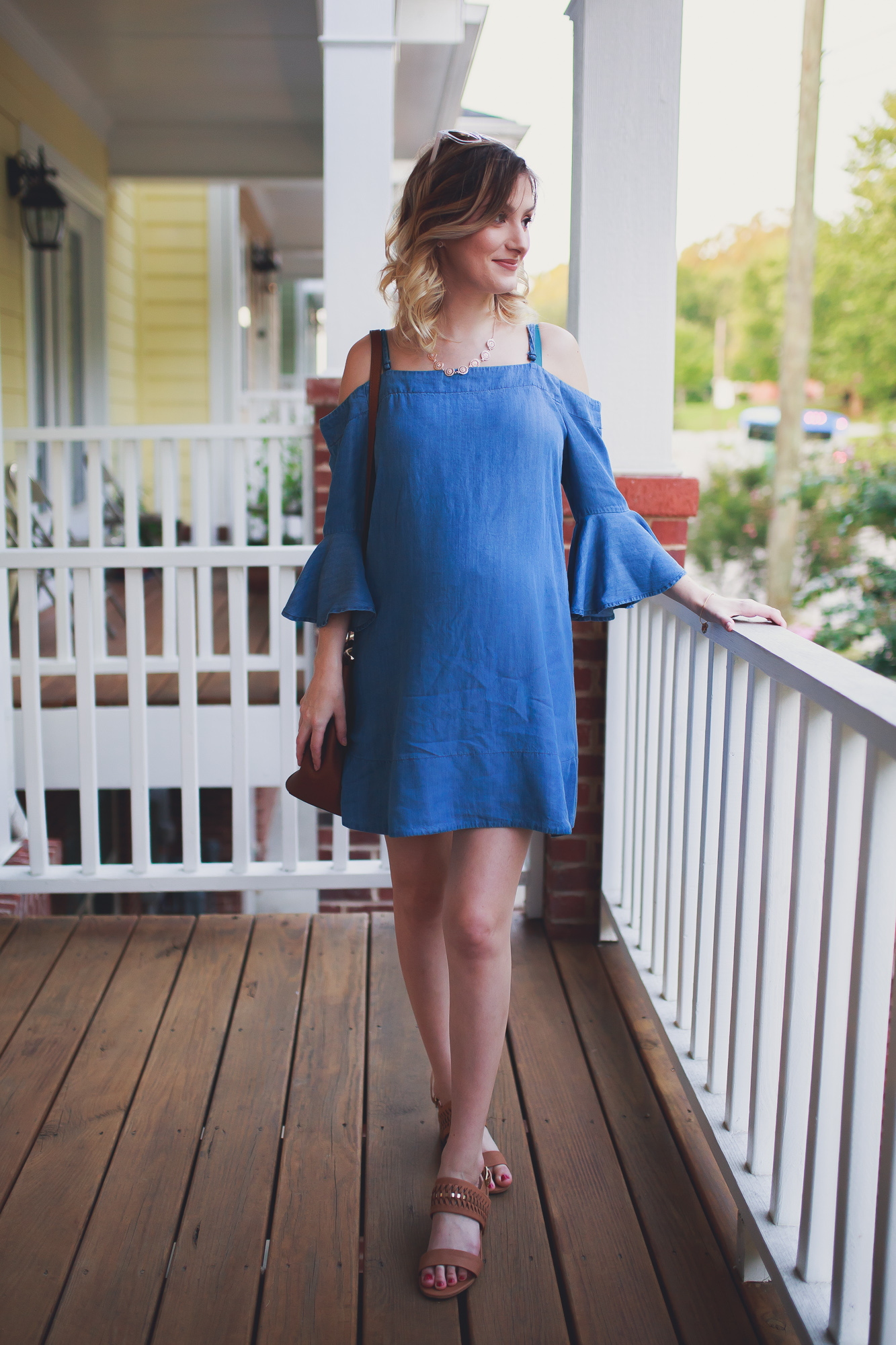 fashion, lifestyle, and beauty blogger and vlogger Jessica Linn from Linn Style wearing a chambray cold shoulder dress from Francesca's, brown heels from Matisse Footwear, a brown Michael Kors Bag, Necklace from Francesca's, and a bracelet from local North Carolina CY Design Studio. You don't have to wear only maternity clothes when you're pregnant. You can wear non-maternity maternity clothes!