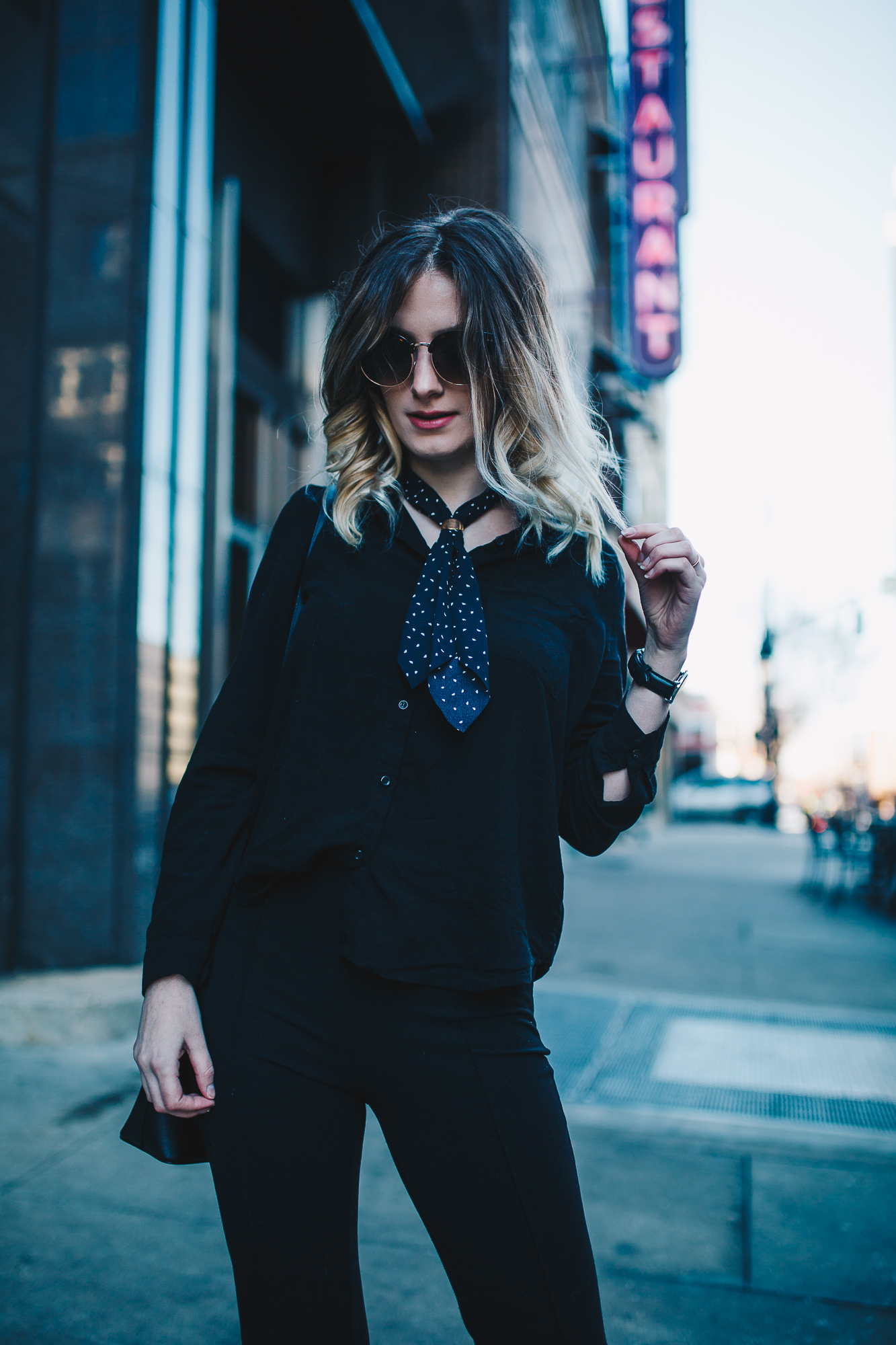 North Carolina fashion and lifestyle blogger Jessica Linn wearing a black button up blouse and black pintucked flare pants from Forever21, a neckerchief from Romwe, sunglasses from Francescas, thrifted green pointy toe heels, and a Welly Merck watch.