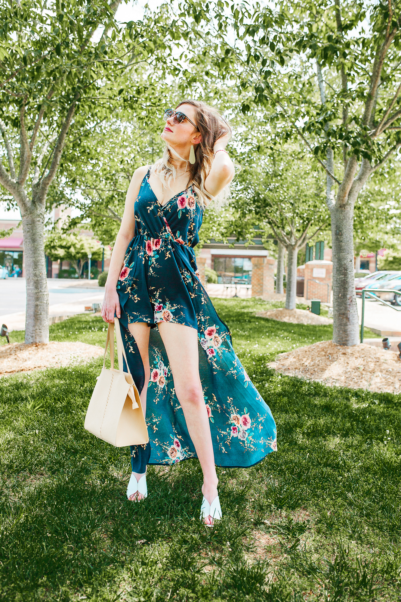 Romper Maxi Dress Combination is the perfect way to dress up during the summer! This summer / spring outfit captures the romper trend, as well as the chunky heel mule trend. North Carolina fashion and lifestyle blogger Jessica Linn is wearing a romper maxi dress from Copper Bloom, a nude purse by Universal Thread from Target, white chunky heel mules by Who What Wear from Target, gold leather statement earrings from RSA Studios, and a layered choker necklace from sugar fix Baublebar.