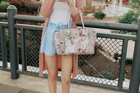 Summer outfit styled by North Carolina fashion blogger Jessica Linn. Blue and white gingham shorts from Copper Bloom, White tank top, pink cardigan from Romwe, Purple floral purse from TJ Maxx, and heels.