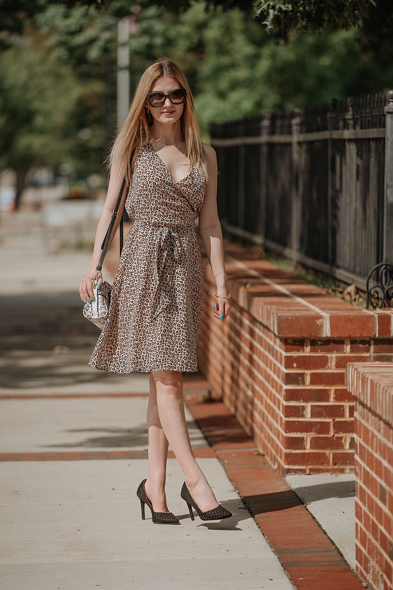 How To Style Leopard Print |Affordable leopard print midi sleeveless dress from Target, black studded heels by Christian Siriano for Payless, and a black and white snake skin purse from Coach. Fashion inspiration by North Carolina fashion and lifestyle blogger Jessica Linn from Linn Style